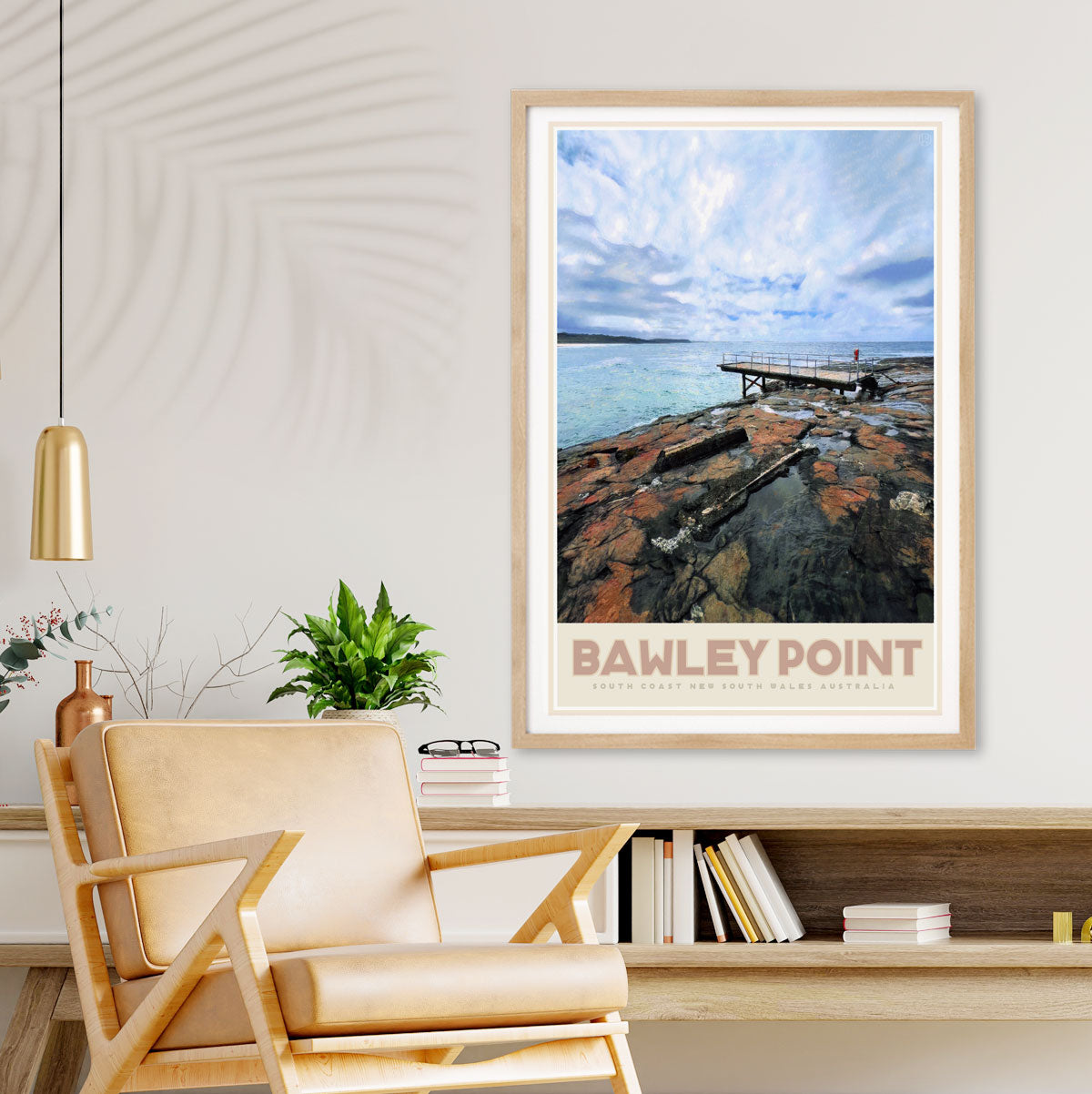 Framed artwork of Bawley Point NSW on a wall above a chair and shelf.